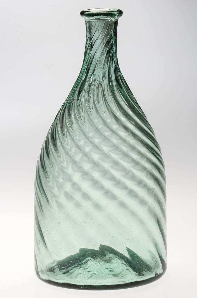PATTERN-MOLDED MIDWESTERN TOILET BOTTLE: PATTERN-MOLDED MIDWESTERN TOILET BOTTLE, blue green, diminutive conical form with 18 ribs swirled to the left and then back to the right at the tapered neck and flanged mouth, kick-up base with a very