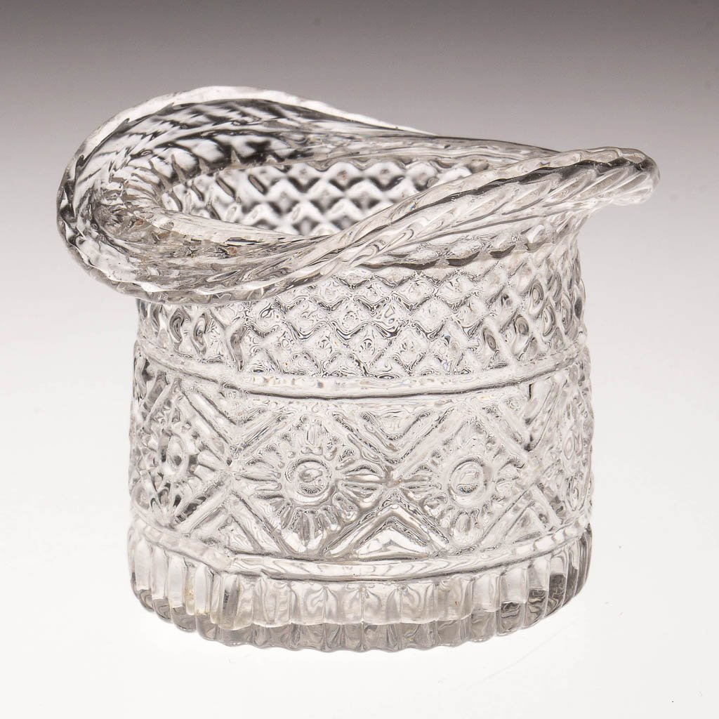 BLOWN-MOLDED GIII-23 HAT OPEN SALT: BLOWN-MOLDED GIII-23 HAT OPEN SALT, colorless, wide folded rim, rayed base with rough pontil mark. Boston & Sandwich Glass Co. Circa 1825-1835. 2 1/8" H, 2 3/8" x 2 5/8". Literature: B & K I, fig. 132