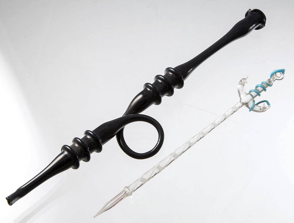 FREE-BLOWN GLASS WHIMSY NOVELTIES, LOT OF TWO: FREE-BLOWN GLASS WHIMSY NOVELTIES, LOT OF TWO, comprising a charcoal gray long cigarette holder, and a colorless and opal dip pen with anchor-form end and opaque powder blue rope. Circa 1860-1900. 6 3
