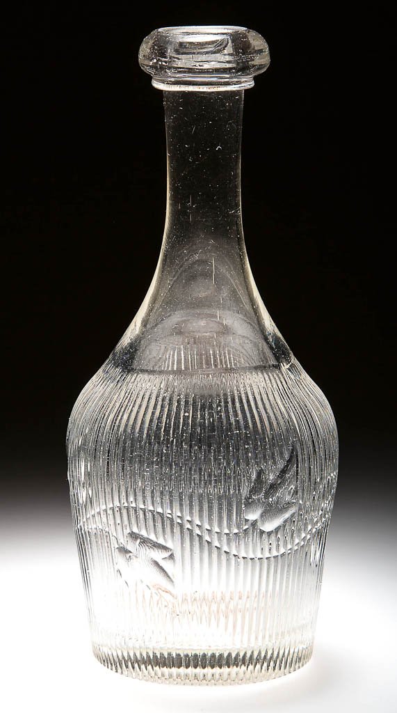 RIBBED IVY HALF-PINT DECANTER: RIBBED IVY HALF-PINT DECANTER, colorless lead glass, with applied bar lip. Third quarter 19th century. 7 1/4" H. Provenance: Property from the Trestle Brook Collection of New Jersey.