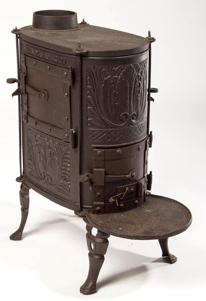 PENNSYLVANIA CAST-IRON DIMINUTIVE HEATING STOVE: PENNSYLVANIA CAST-IRON DIMINUTIVE HEATING STOVE, marked "HAYS & CO", cast at the Hays (Charlotte) Furnace, Perry Co., PA, three hinged lift-off doors, raised on four hoof-like feet. Brass plaque mount