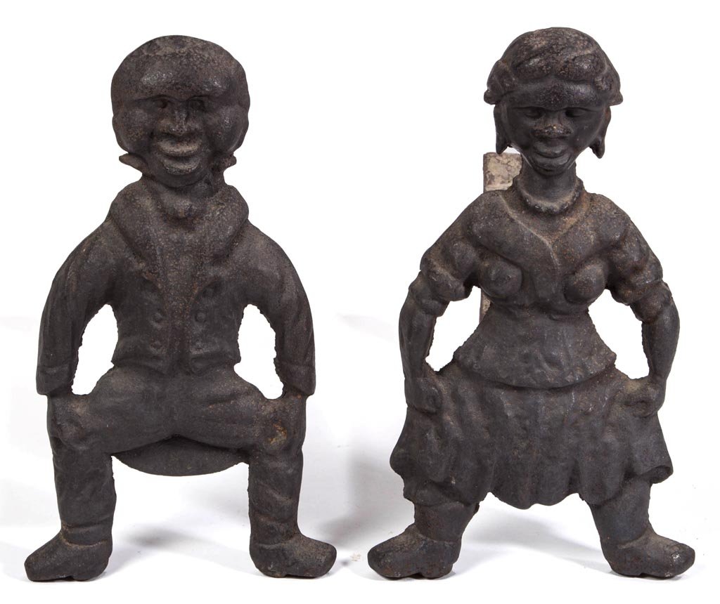 PAIR OF AMERICAN CAST-IRON FIGURAL ANDIRONS: PAIR OF AMERICAN CAST-IRON FIGURAL ANDIRONS, depicting a male and a female African-American dancers, each with hands on knees, original removable log supports. Old. Probably original black-painted fro