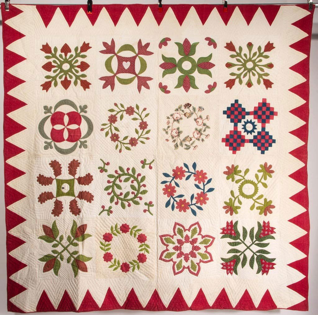 MID-ATLANTIC SIGNED AND DATED 1853 "FRIENDSHIP ALBUM": MID-ATLANTIC SIGNED AND DATED 1853 "FRIENDSHIP ALBUM" APPLIQUE QUILT, sixteen 16 1/2" SQ blocks each with a floral patterned sprig or wreath in print fabric and including one chintz example, most sign