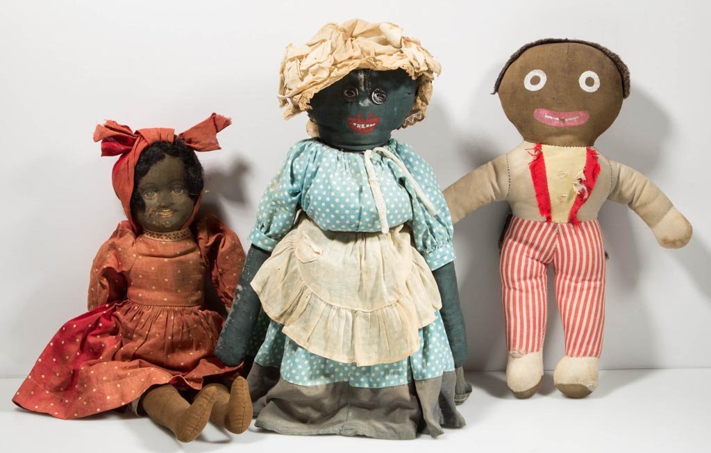 AFRICAN AMERICAN RAG / CLOTH DOLLS, LOT OF THREE: AFRICAN AMERICAN RAG / CLOTH DOLLS, LOT OF THREE, including one supported on a glass milk bottle. First half 20th century. 11 1/2" to 14" H. Provenance: From a 35-year Augusta Co., VA collection.