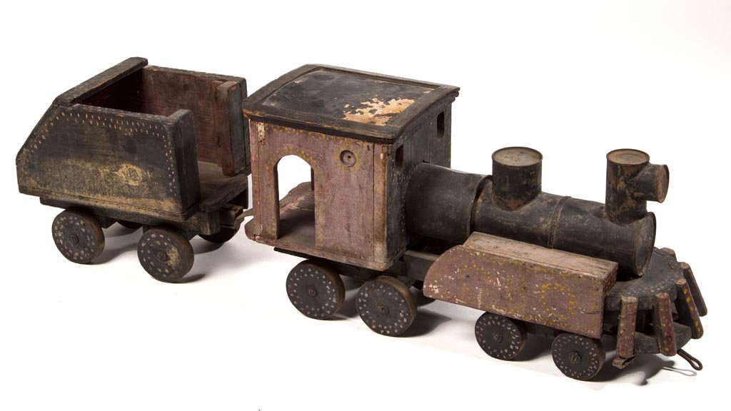 VIRGINIA FOLK ART WOODEN TRAIN RIDING TOY: VIRGINIA FOLK ART WOODEN TRAIN RIDING TOY, a whimsical creation covered in original polychrome-painted decoration, featuring an engine with tender. Discovered in a Petersburg, VA estate. Circa 1910-19