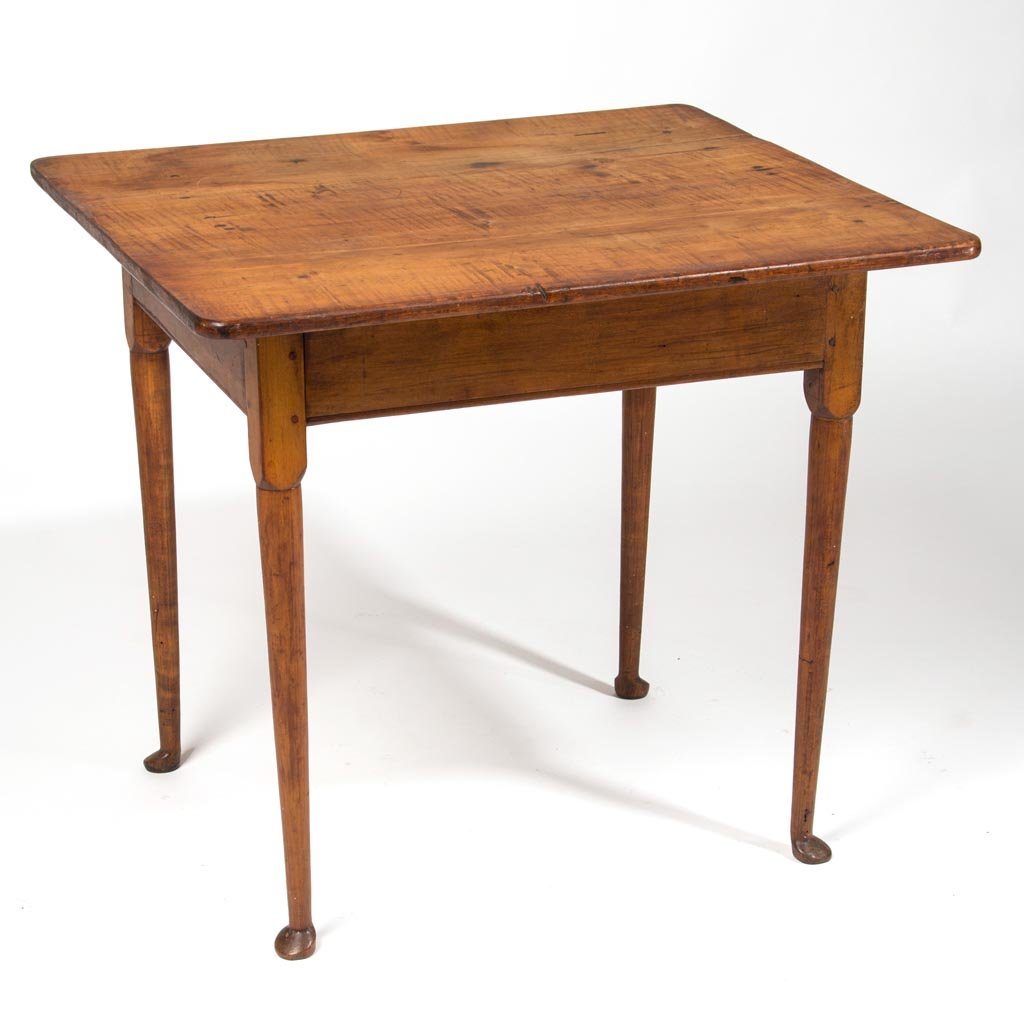 AMERICAN, PROBABLY NEW ENGLAND, QUEEN ANNE FIGURED: AMERICAN, PROBABLY NEW ENGLAND, QUEEN ANNE FIGURED MAPLE TEA TABLE, the rectangular top over a beaded-edge apron raised on turned straight legs ending in pad feet. Old refinished surface with golden c