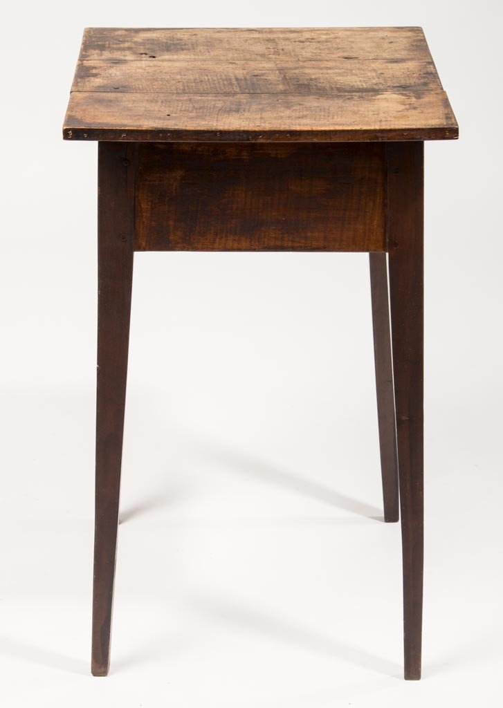 AMERICAN FEDERAL TIGER MAPLE STAND TABLE: AMERICAN FEDERAL TIGER MAPLE STAND TABLE, the three-board top over a plain apron raised on finely tapered square legs. Worn varnished surface. 19th century. 29 1/4" H, 17 1/2 x 18" top. Provenance: Pr