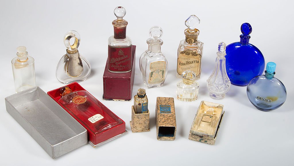 ASSORTED GLASS PERFUME BOTTLES, LOT OF 12: ASSORTED GLASS PERFUME BOTTLES, LOT OF 12, French including two blue Worth marked for Lalique, two Larkin, four with original box. Early to late 20th century. 1 3/4" to 5" H.