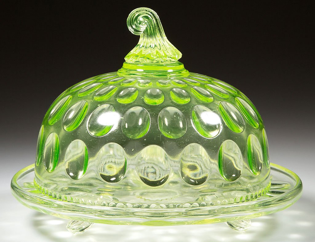 INVERTED THUMBPRINT COVERED CHEESE DISH: INVERTED THUMBPRINT COVERED CHEESE DISH, vaseline (uranium). King Glass Co. Pattern introduced 1880. 6 1/2" HOA, plate 8 5/8" D. Literature: Peterson - Vaseline Glass, p. 89, fig. 920. Provenance: Col