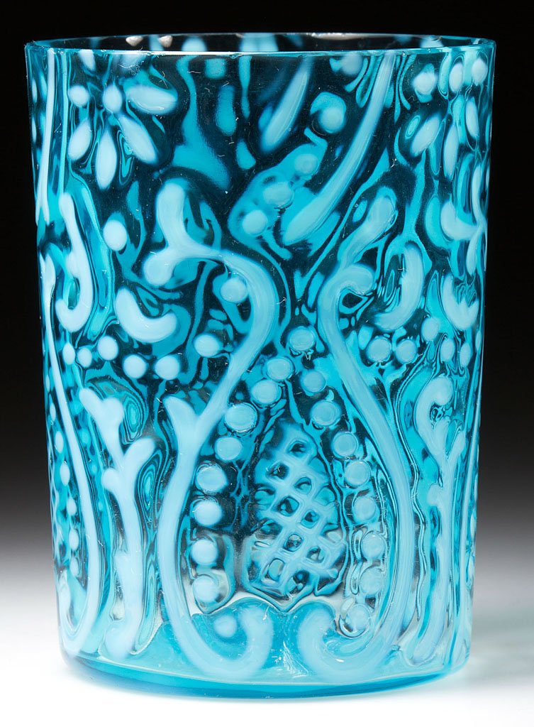 ARABIAN NIGHTS TUMBLER: ARABIAN NIGHTS TUMBLER, blue opalescent, with molded base. Possibly Beaumont Glass Co./Northwood Glass Co. Late 19th/early 20th century. 3 7/8" H. Provenance: From a New York private collection.