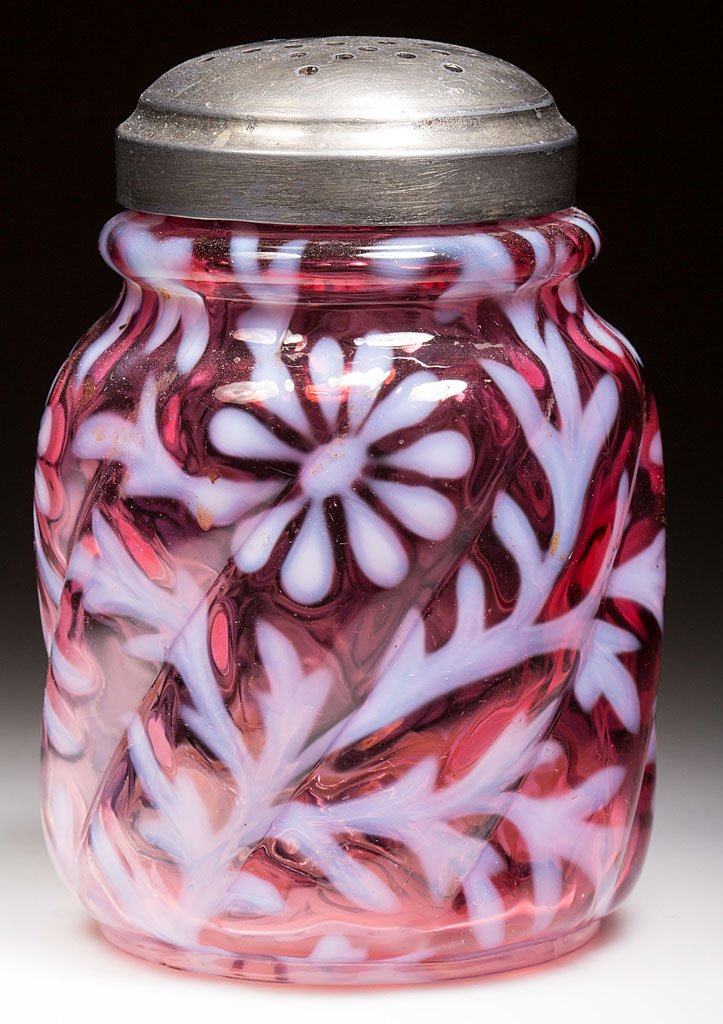 DAISY AND FERN - PARIAN SWIRL SUGAR SHAKER: DAISY AND FERN - PARIAN SWIRL SUGAR SHAKER, cranberry opalescent, with period lid. Northwood Glass Co. Late 19th/early 20th century. 4 1/8" HOA. Provenance: From the collection of Larry & Diana Nellan