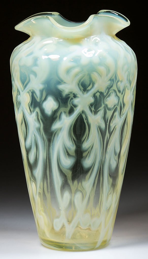 ENGLISH OPALINE BROCADE / SPANISH LACE VASE: ENGLISH OPALINE BROCADE / SPANISH LACE VASE, vaseline (uranium) opalescent, tapered form with ruffled rim, polished base. Late 19th/early 20th century. 8 3/8" HOA, 4" D rim. Literature: Parallels Heac