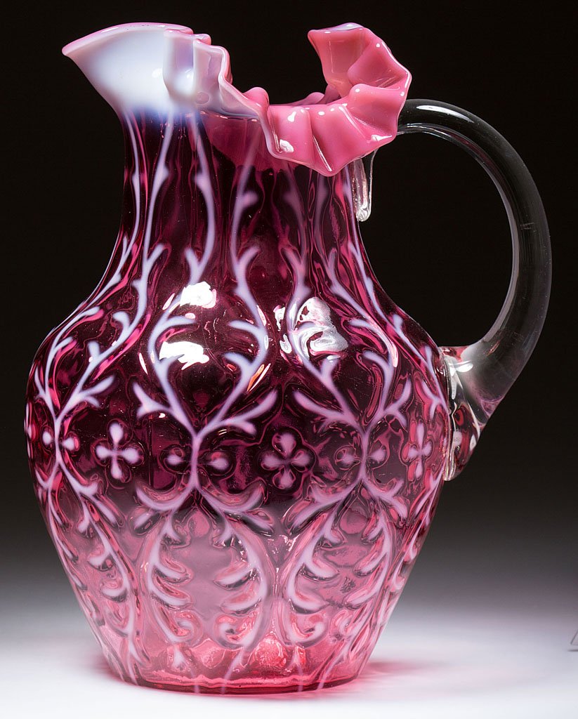 OPALINE BROCADE / SPANISH LACE WATER PITCHER: OPALINE BROCADE / SPANISH LACE WATER PITCHER, cranberry opalescent, shouldered form with three-section crimped and ruffled rim, applied colorless plain handle. National Glass Co. Pattern introduced 18
