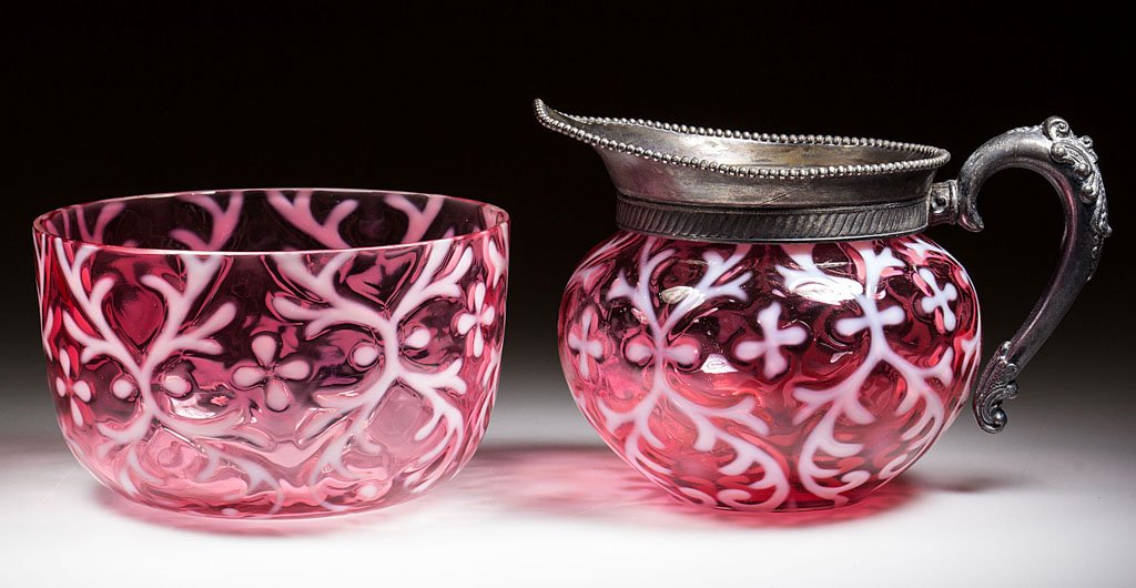 OPALINE BROCADE / SPANISH LACE TABLE ARTICLES, LOT OF: OPALINE BROCADE / SPANISH LACE TABLE ARTICLES, LOT OF TWO, cranberry opalescent, comprising a creamer with unmarked quadruple-plate mount and a finger/waste bowl. Northwood Glass Co. Pattern introduce