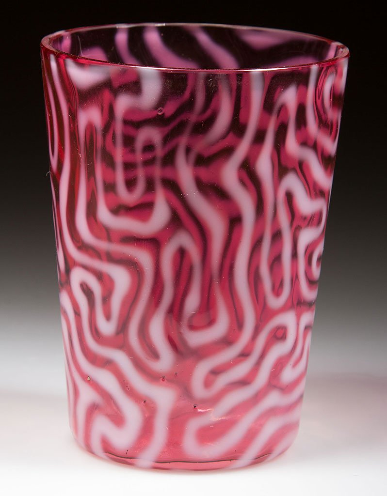 SWIRLING MAZE TUMBLER: SWIRLING MAZE TUMBLER, cranberry opalescent, factory polished rim. Attributed to the Jefferson Glass Co. Circa 1905. 3 7/8" H. Provenance: Collection of the Fenton Art Glass Museum.