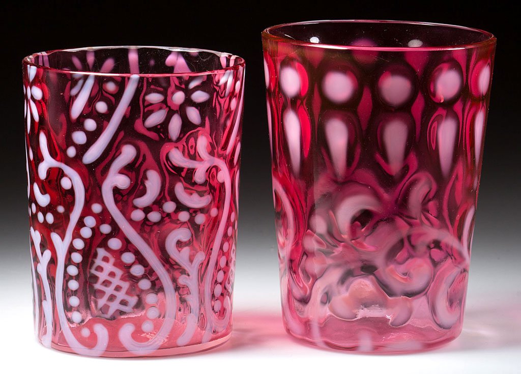 ASSORTED OPALESCENT PATTERN TUMBLERS, LOT OF TWO: ASSORTED OPALESCENT PATTERN TUMBLERS, LOT OF TWO, cranberry opalescent, comprising an Arabian Nights and a Buttons and Braids with factory polished rim. Early 20th century. 3 1/2" and 3 7/8" H. Proven