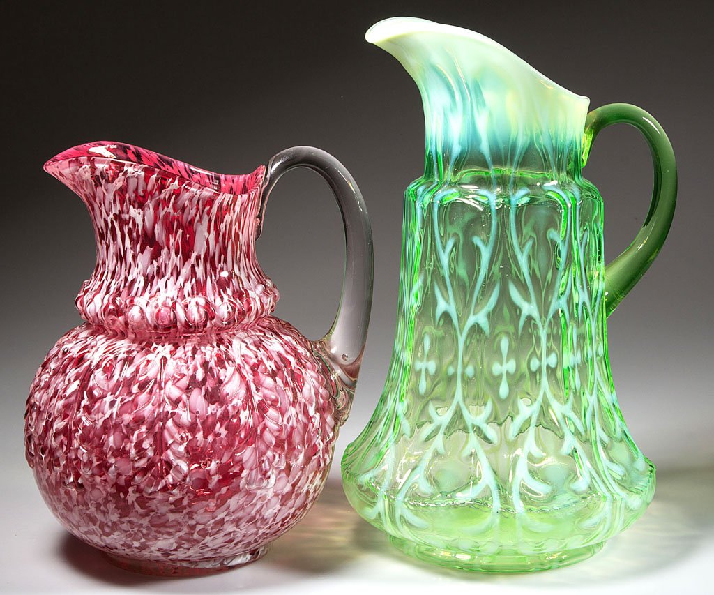 ASSORTED VICTORIAN WATER PITCHERS, LOT OF TWO: ASSORTED VICTORIAN WATER PITCHERS, LOT OF TWO, comprising a green opalescent Opaline Brocade/Spanish Lace eight-panel mold tankard form with pale green applied handle and a Rose Agate/cranberry with o