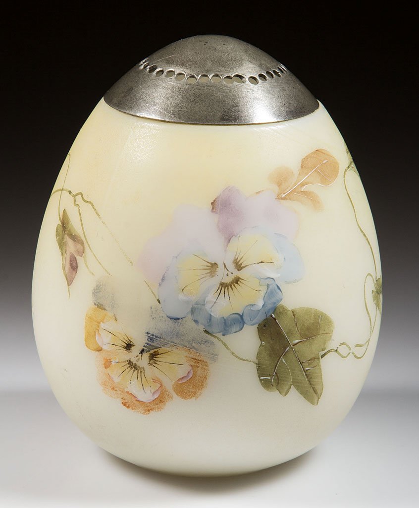 MT. WASHINGTON EGG SUGAR SHAKER: MT. WASHINGTON EGG SUGAR SHAKER, opal with soft yellow cream ground and polychrome pansy decoration, plush/satin finish, period lid. Mt. Washington Glass Co. Fourth quarter 19th century. 4 1/4" HOA.