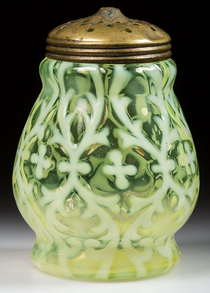 OPALINE BROCADE / SPANISH LACE SUGAR SHAKER: OPALINE BROCADE / SPANISH LACE SUGAR SHAKER, vaseline (uranium) opalescent, with period lid. Northwood Glass Co. Pattern introduced 1899. 4 1/2" HOA. Provenance: From a New York private collection.