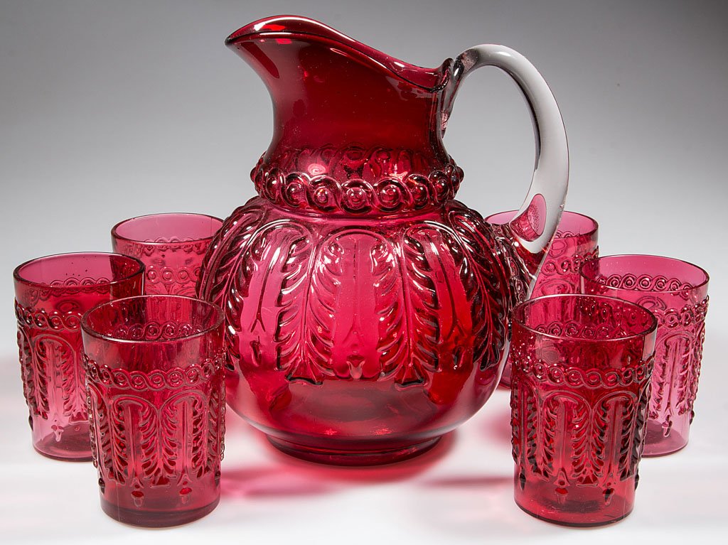 NORTHWOOD NO. 263 / LEAF UMBRELLA SEVEN-PIECE WATER SET: NORTHWOOD NO. 263 / LEAF UMBRELLA SEVEN-PIECE WATER SET, Ruby/cranberry, comprising a pitcher with an applied colorless handle, and six tumblers. Northwood Glass Co. Pattern introduced 1889. 3 3/4" to
