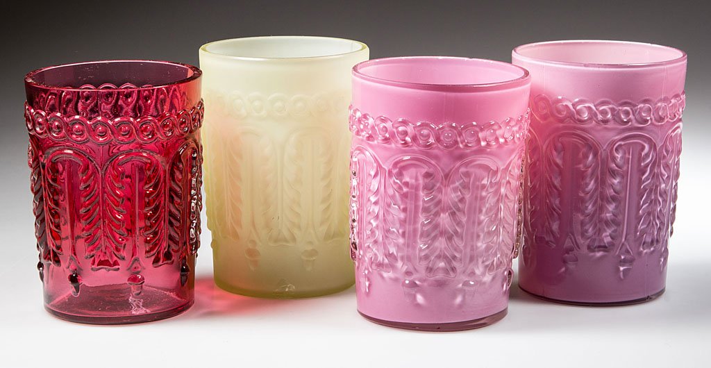 NORTHWOOD NO. 263 / LEAF UMBRELLA TUMBLERS, LOT OF FOUR: NORTHWOOD NO. 263 / LEAF UMBRELLA TUMBLERS, LOT OF FOUR, comprising two Rose du Berry/cased pink, a Ruby/cranberry, and a Topaz/cased lemon satin (uranium) examples. Northwood Glass Co. Pattern introd