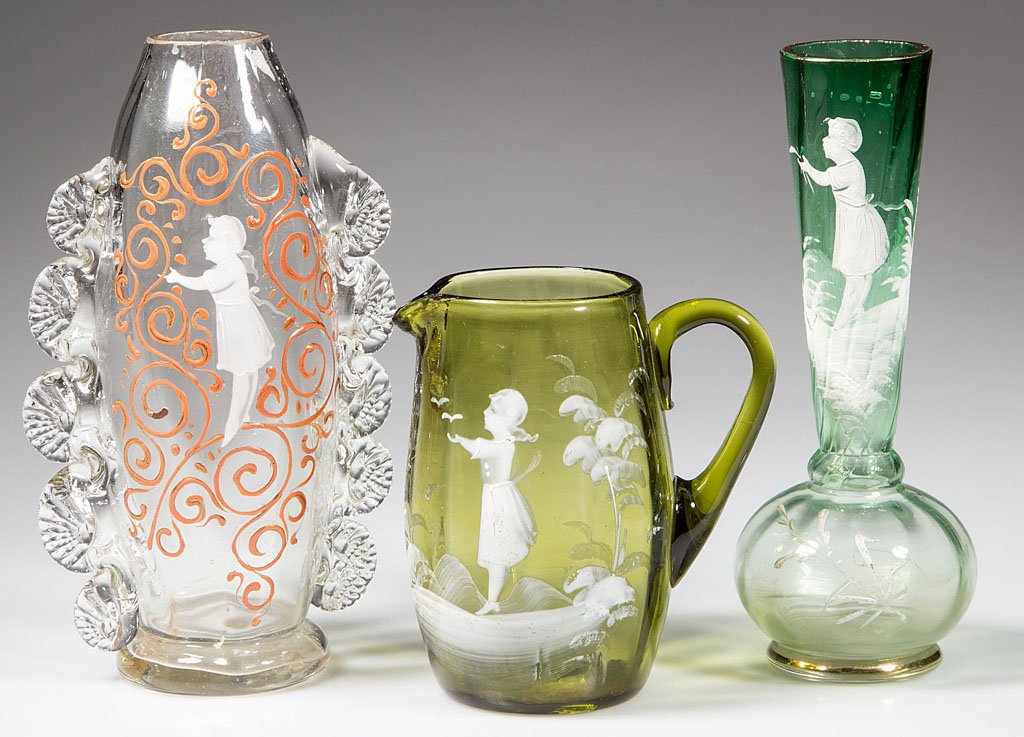 MARY GREGORY (SO CALLED) DECORATED RIB-OPTIC ARTICLES,: MARY GREGORY (SO CALLED) DECORATED RIB-OPTIC ARTICLES, LOT OF THREE, colorless and shades of green, comprising a creamer and two vases, one with applied rigaree decoration, each painted in white ename