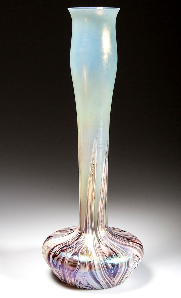 LOETZ-TYPE BOHEMIAN VASE: LOETZ-TYPE BOHEMIAN VASE, pale-green iridescent with pulled feather-like decoration projecting from base, truncated conical body with tall slender neck and polished rim. Probably Rindskopf. Circa 1900