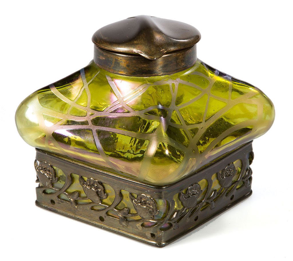 LOETZ-TYPE BOHEMIAN INK WELL: LOETZ-TYPE BOHEMIAN INK WELL, green iridescent with random violet ribbon threads, square form with protruding corners, brass-color metal base mount and hinged cover stamped "OE. P. 10385 / D. R. G. M.