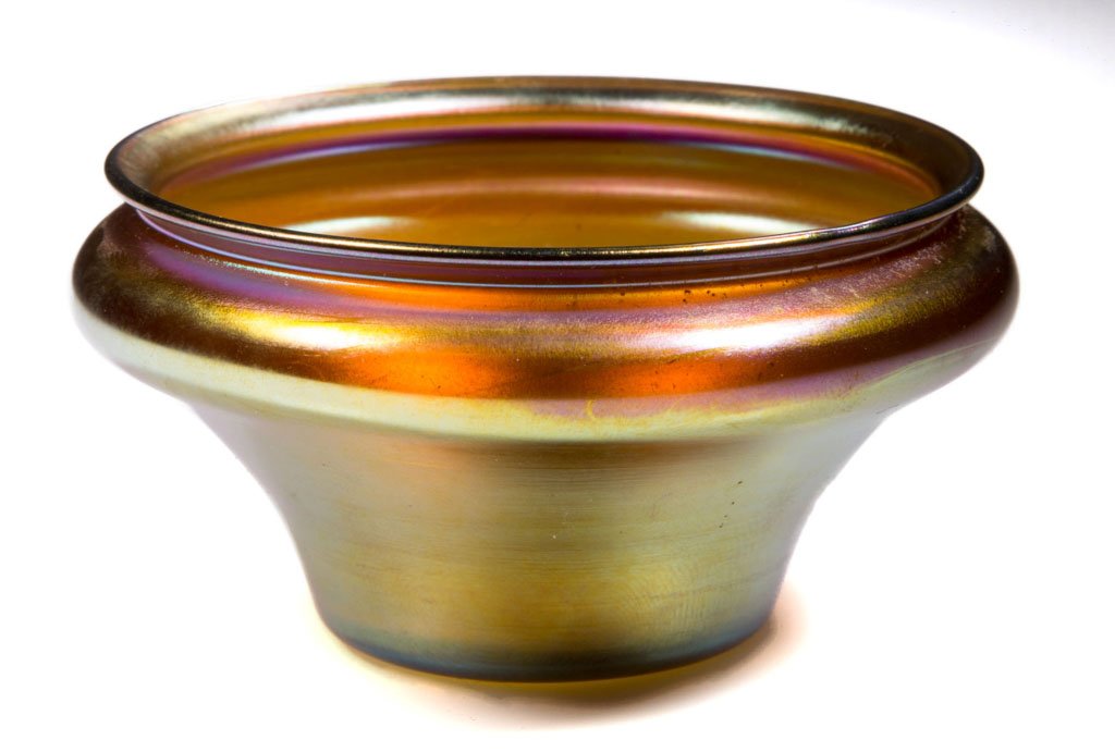 QUEZAL ART GLASS OPEN SALT: QUEZAL ART GLASS OPEN SALT, gold iridescent, low urn form signed "QUEZAL" within the polished pontil mark. Quezal Art Glass and Decorating Co. First quarter 20th century. 1 3/4" H, 3" D.