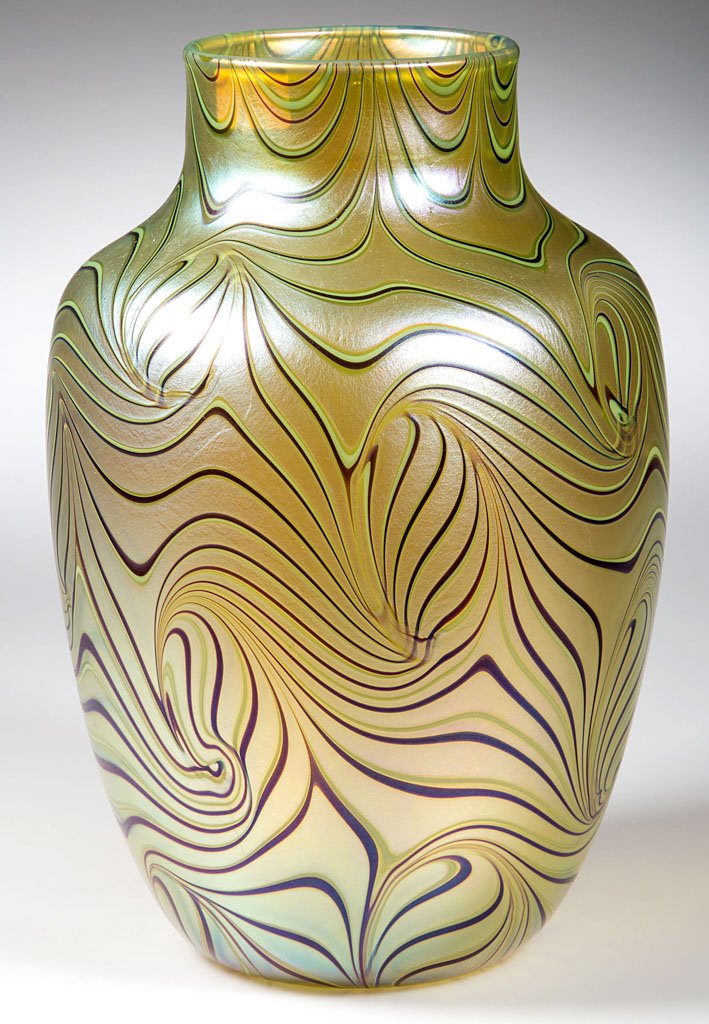 ORIENT & FLUME STUDIO GLASS VASE: ORIENT & FLUME STUDIO GLASS VASE, gold iridescent with King Tut-style design, signed and dated 1981 around the applied polished pontil disk. 8" H.