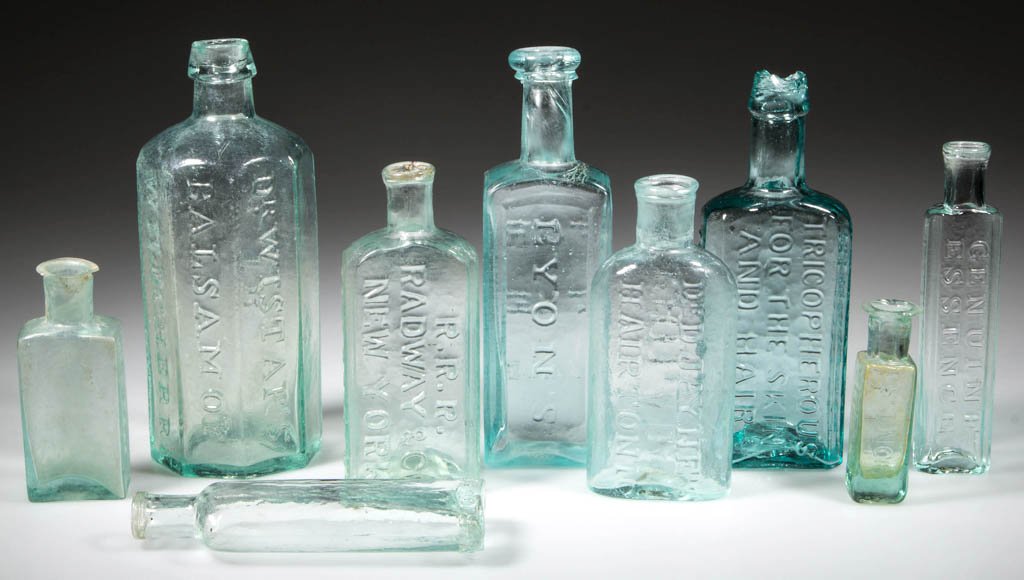ASSORTED PONTILED MEDICINE BOTTLES, LOT OF NINE: ASSORTED PONTILED MEDICINE BOTTLES, LOT OF NINE, aquamarine, embossed, including octagonal form "DR. WISTAR'S / BALSAM OF / WILD CHERRY / PHILADA / / IB." with applied collared mouth; square form "BY
