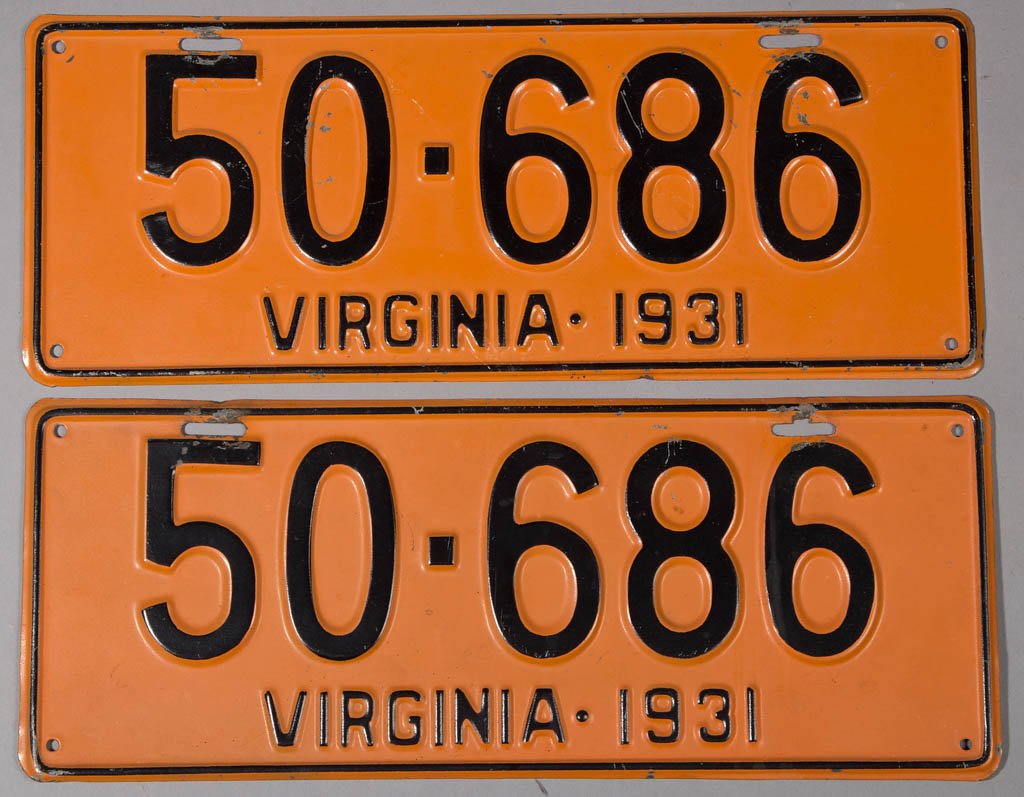 1931 VIRGINIA LICENSE PLATES, PAIR: 1931 VIRGINIA LICENSE PLATES, PAIR, orange with black lettering, each with four holes and two slots for hanging. 5 7/8" x 15". Provenance: Collection of Joe C. Yancey, Harrisonburg, VA.