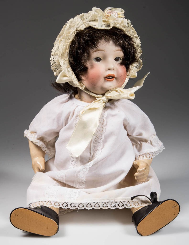 NIPPON BISQUE-HEAD CHARACTER CHILD DOLL: NIPPON BISQUE-HEAD CHARACTER CHILD DOLL, socket head incised "12 A" / "151" in a circle / "NIPPON", black hair wig, brown sleepy eyes, painted eyebrows and eyelashes, open mouth with teeth, original b