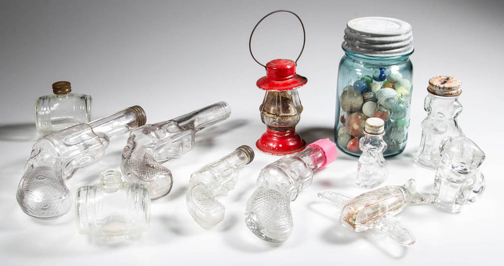 FIGURAL GLASS CANDY CONTAINERS, LOT OF 12: FIGURAL GLASS CANDY CONTAINERS, LOT OF 12, colorless, including pistols, animals, barrels, a lantern, and an airplane. Included in lot is a Ball Perfect Mason jar with glass and ceramic marbles. First