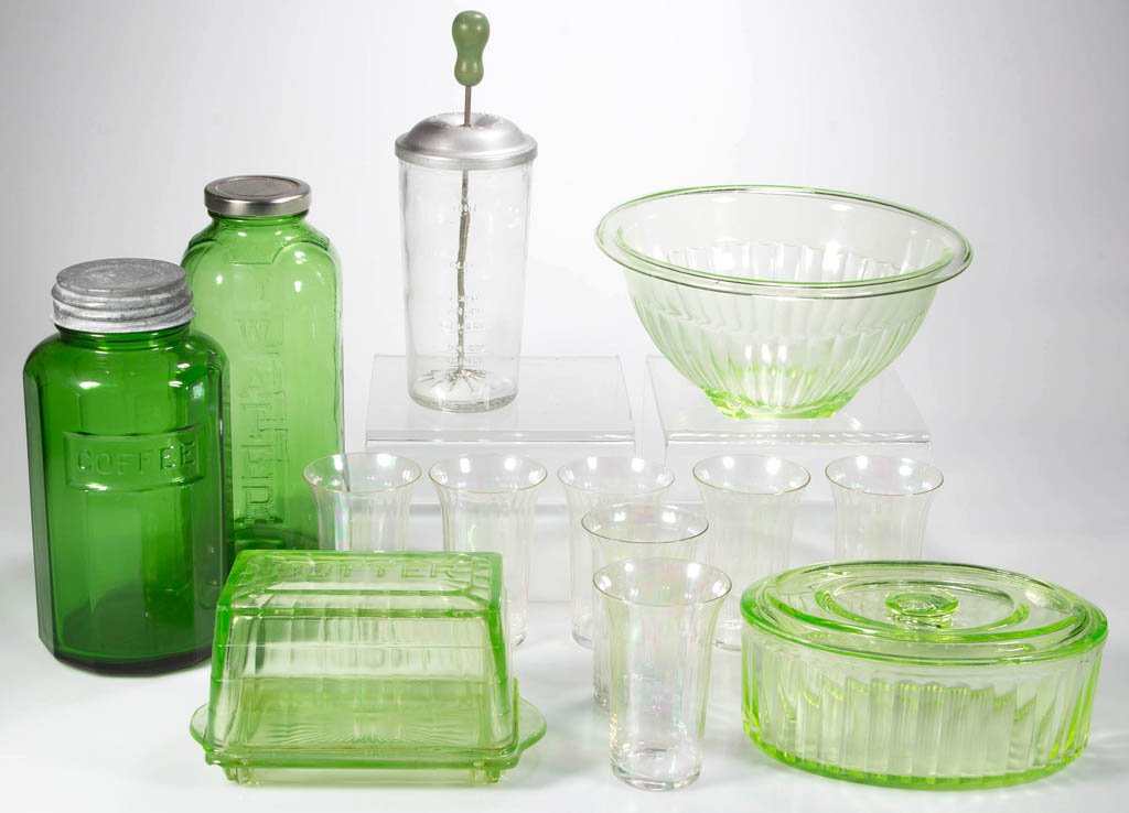 ASSORTED KITCHENWARE DEPRESSION-ERA GLASS ARTICLES, LOT: ASSORTED KITCHENWARE DEPRESSION-ERA GLASS ARTICLES, LOT OF 13, colorless, green, and forest green, comprising seven rib optic juice glasses, a beverage and a coffee container, covered butter, a covere