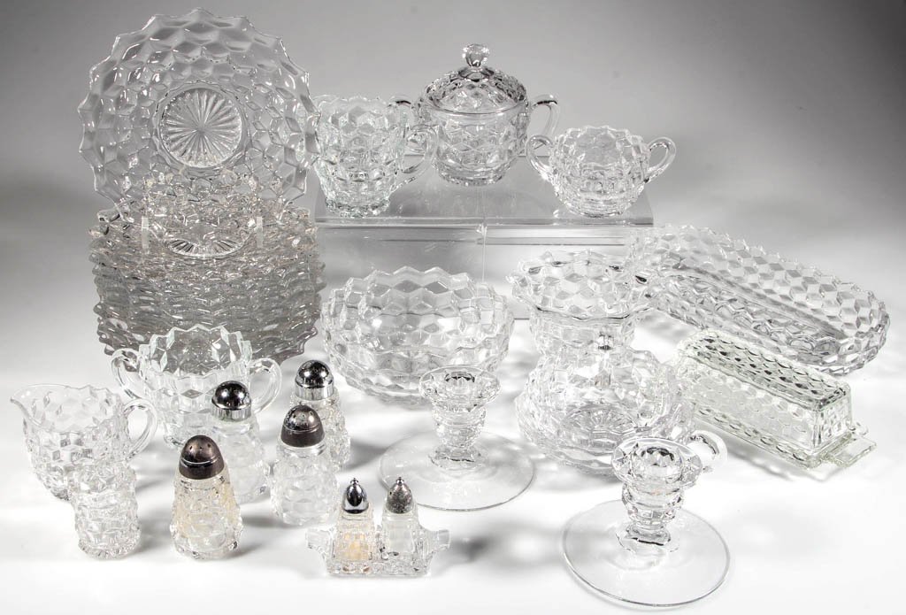FOSTORIA AMERICAN ARTICLES, LOT OF 33: FOSTORIA AMERICAN ARTICLES, LOT OF 33, including 12 plates, a covered sugar, and a pair of candle holders. Fostoria Glass Co. Mid 20th century. Various sizes. Provenance: Collection of Joe C. Yancey, 