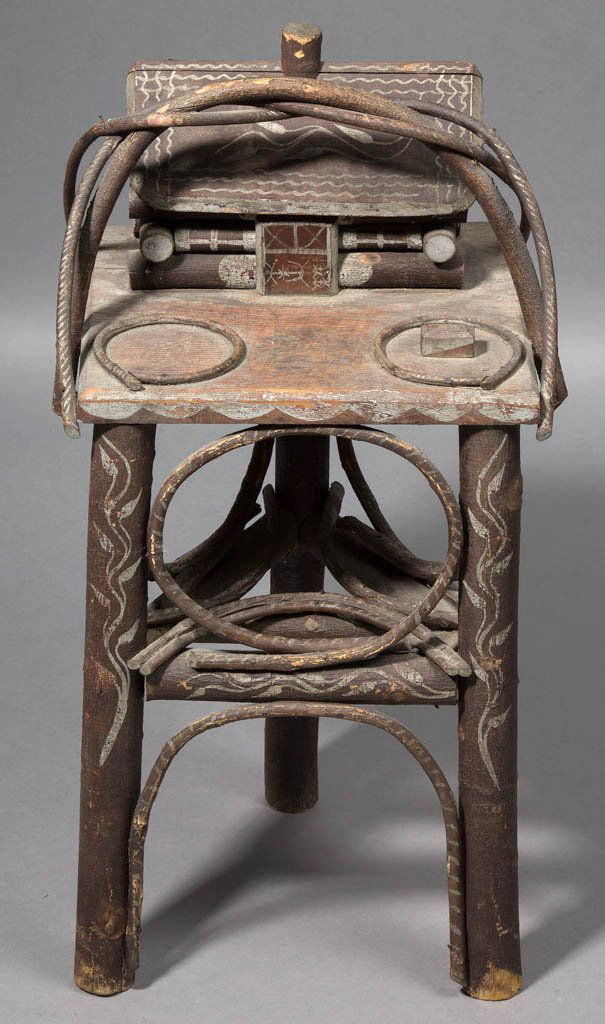 SOUTHERN PAINT-DECORATED TWIG SMOKING STAND: SOUTHERN PAINT-DECORATED TWIG SMOKING STAND, rings for ashtray and match holder in front of a cabin with removable roof, raised on three legs with a medial shelf. Original dry surface and silver-paint