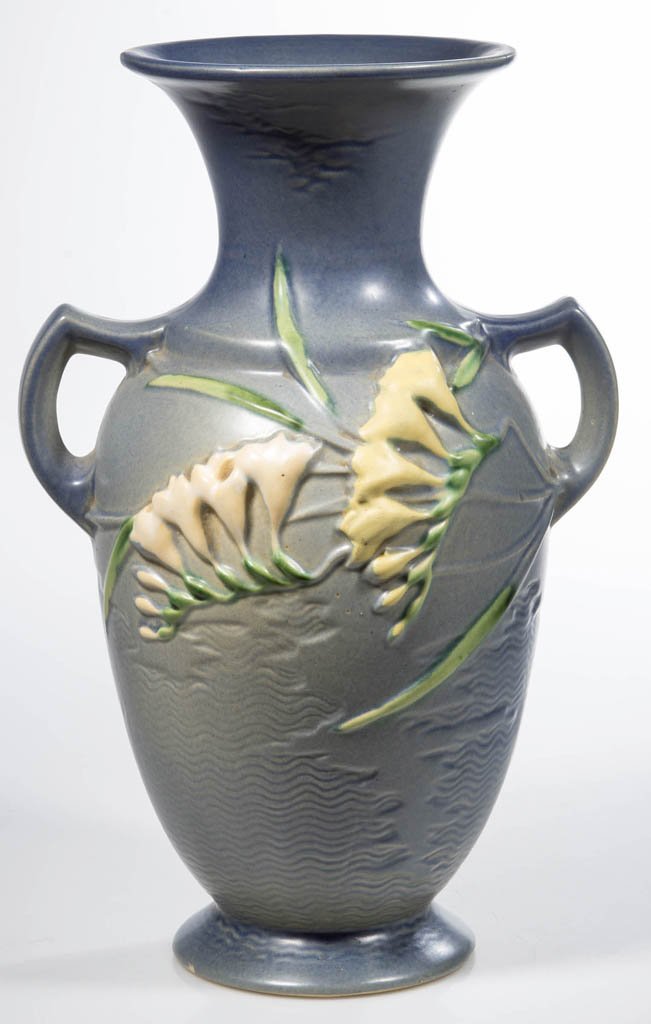 ROSEVILLE "FREESIA" ART POTTERY VASE: ROSEVILLE "FREESIA" ART POTTERY VASE, blue, two open handles, raised mark and "127-12" under base. Circa 1945. 12 1/2" H. Provenance: Property of a Rockingham Co., VA collector.