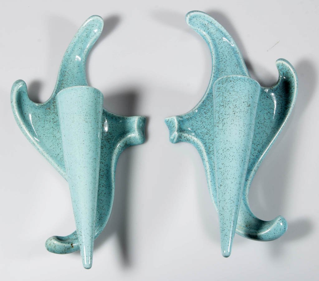 RED WING NO. 1454L MODERN ART POTTERY WALL SCONCES,: RED WING NO. 1454L MODERN ART POTTERY WALL SCONCES, PAIR, blue fleck, scroll wall plate supporting a cone-form single-socket candleholder, back incised "RED WING / U.S.A. / 1454 / L". Mid 20th century