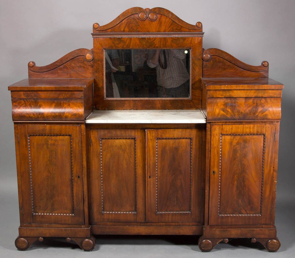 AMERICAN LATE CLASSICAL MAHOGANY SIDEBOARD: AMERICAN LATE CLASSICAL MAHOGANY SIDEBOARD, the relatively diminutive form featuring mirrored back, marble insert, and highly figured veneer. Poplar secondary wood. Old refinished surface with mellow 