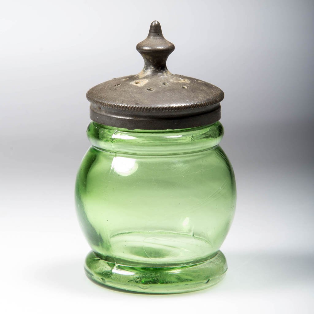 BLOWN-MOLDED CHRISTMAS PEPPER SHAKER: BLOWN-MOLDED CHRISTMAS PEPPER SHAKER, bright yellow green, short barrel form with 15-ray base and Britannia lid. Boston & Sandwich Glass Co. and others. Fourth quarter 19th century. 2 1/2" HOA, 1 1/2"