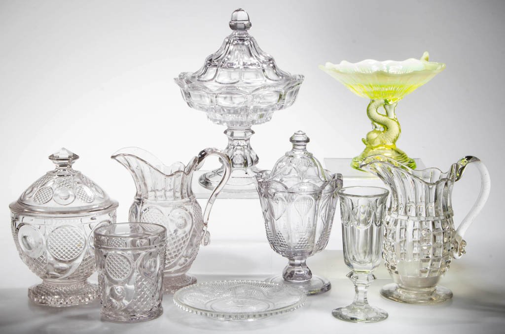 ASSORTED FLINT EAPG TABLE ARTICLES, LOT OF SEVEN: ASSORTED FLINT EAPG TABLE ARTICLES, LOT OF SEVEN, colorless lead glass, including a Paneled Waffle creamer and a Balloon, Heart and Lyre covered sugar. Together with a reproduction Horn of Plenty tumb