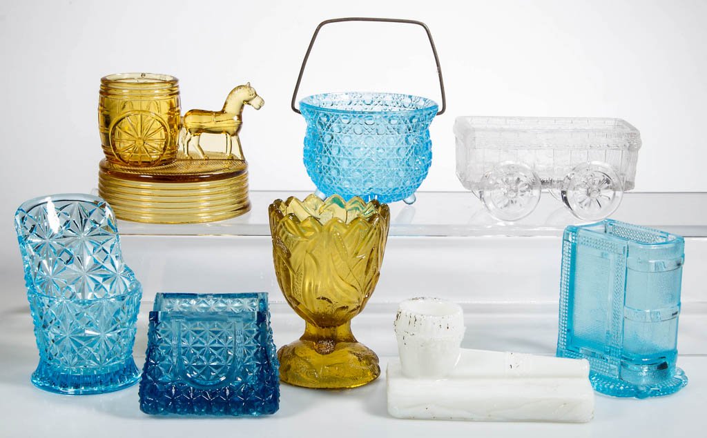 ASSORTED NOVELTY TOOTHPICK / MATCH HOLDERS, LOT OF: ASSORTED NOVELTY TOOTHPICK / MATCH HOLDERS, LOT OF EIGHT, colorless, amber, blue, and opaque white, including Book, Horse with Cart, Purse, and Sitz Bath holders. Fourth quarter 19th/early 20th centur