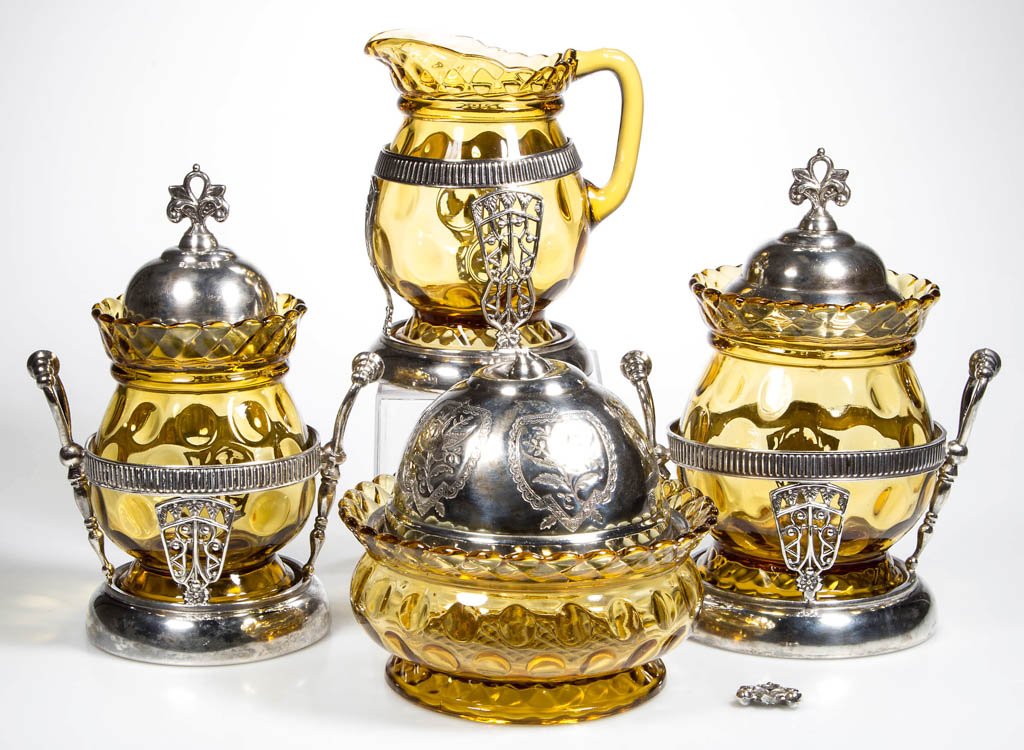 CENTRAL NO. 796 / ROPE AND THUMBPRINT TABLE ARTICLES,: CENTRAL NO. 796 / ROPE AND THUMBPRINT TABLE ARTICLES, LOT OF FOUR, amber, consisting of creamer, large and small covered sugars, and covered butter dish, all fitted in quadruple-plate frames. Central