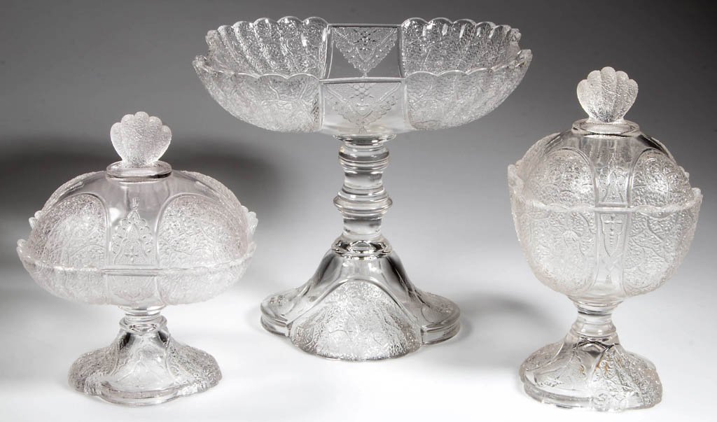DUNCAN NO. 555 / SHELL AND TASSEL TABLE ARTICLES, LOT: DUNCAN NO. 555 / SHELL AND TASSEL TABLE ARTICLES, LOT OF THREE, colorless, each square form, comprising a covered butter, covered sugar, and open compote. Geo. Duncan & Sons, Pittsburgh, PA. Circa 188