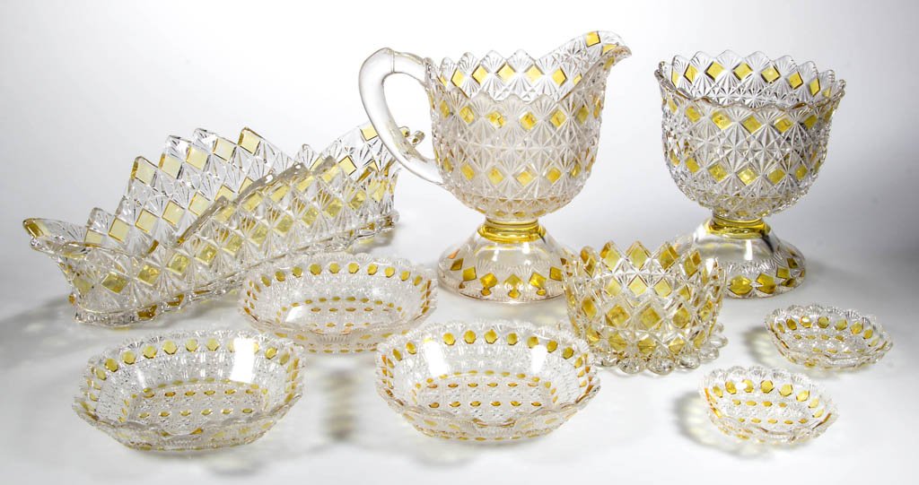 FINE CUT AND BLOCK - AMBER-STAINED TABLE ARTICLES, LOT: FINE CUT AND BLOCK - AMBER-STAINED TABLE ARTICLES, LOT OF NINE, colorless, including of a celery tray and master salt. King, Son & Co. and U.S. Glass Co. Circa 1885-1891. Spooner 5 1/8" H, celery 11 3