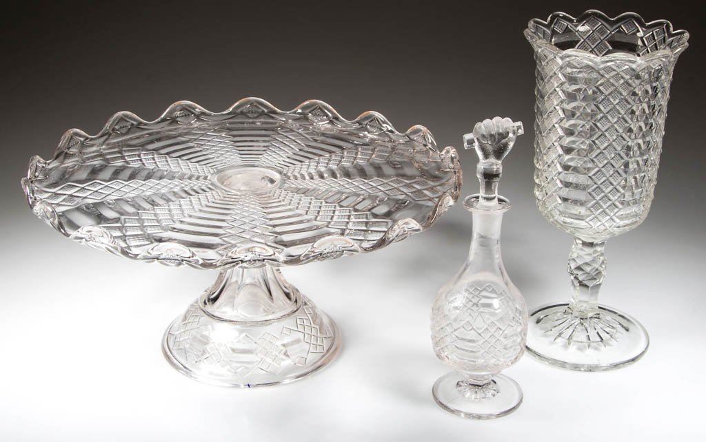 JACOB'S LADDER TABLE ARTICLES, LOT OF THREE: JACOB'S LADDER TABLE ARTICLES, LOT OF THREE, colorless, comprising a cake stand/salver, a celery vase, and an oil bottle with Hand and Bar stopper. Bryce Bros., Pittsburgh, PA. Fourth quarter 19th cen