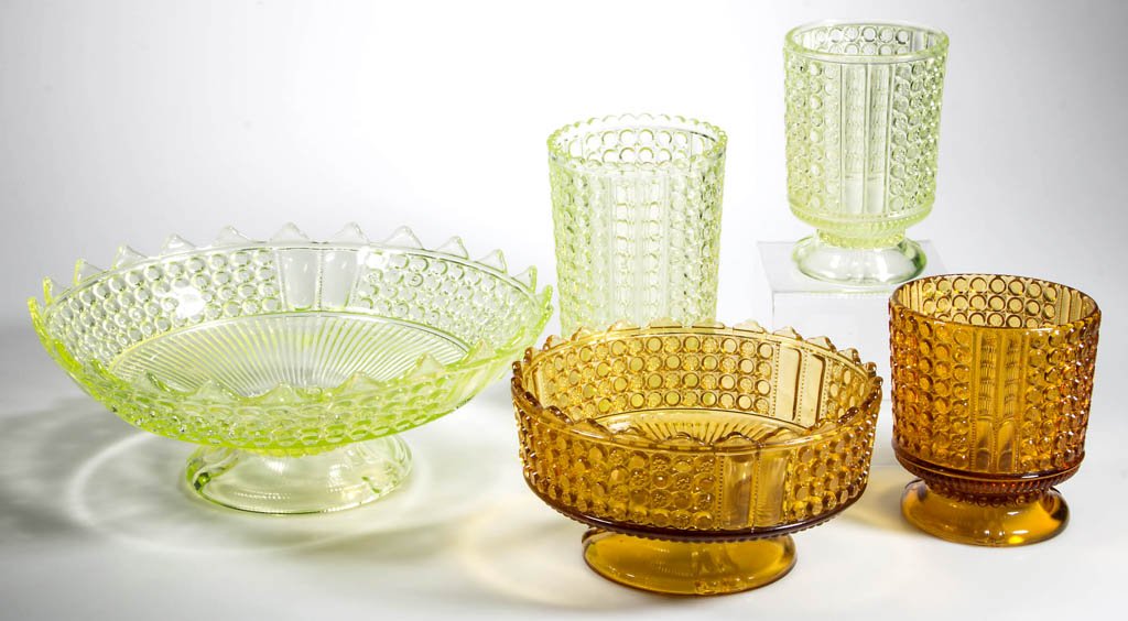THREE PANEL TABLE ARTICLES, LOT OF FIVE: THREE PANEL TABLE ARTICLES, LOT OF FIVE, vaseline (uranium) and amber, including a celery vase and a large footed bowl. Fourth quarter 19th century. Celery 6 1/2" H, large bowl 11" D. Provenance: From