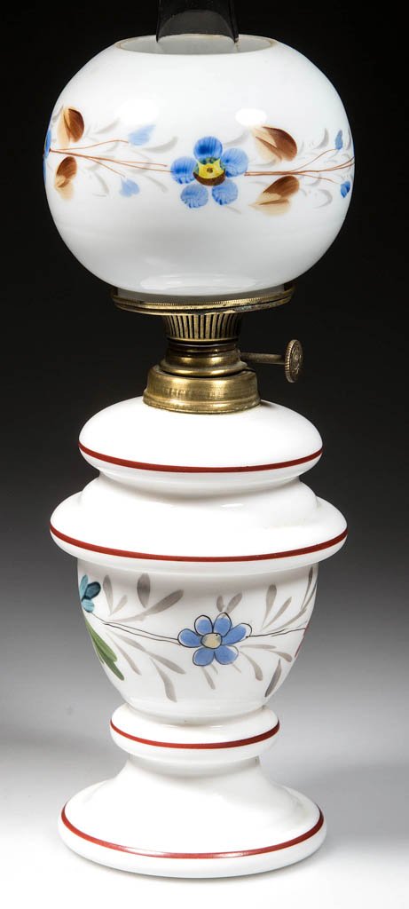 POLYCHROME ENAMELED MINIATURE OIL LAMP: POLYCHROME ENAMELED MINIATURE OIL LAMP, white Bristol-type, with ball shade. Shade has blue, yellow, brown and gray floral decoration. Base has blue, yellow, gray, rust and green floral decoration. Pe