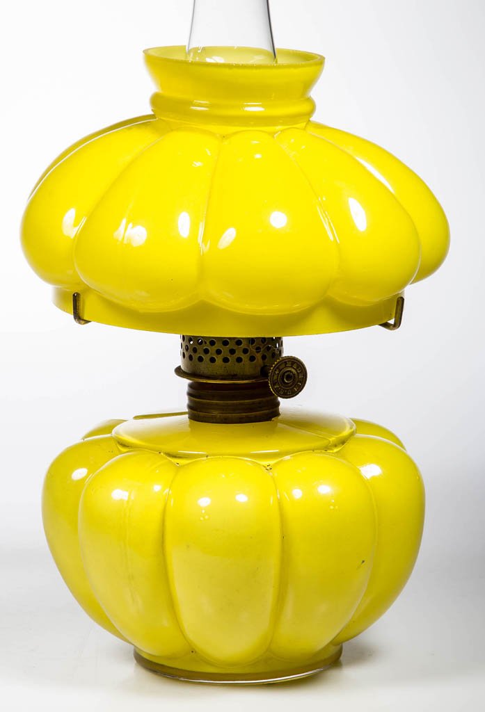MELON RIB MINIATURE OIL LAMP: MELON RIB MINIATURE OIL LAMP, cased yellow with glossy finish, with matching umbrella shade. Period burner, tripod and stenciled "Acme" chimney. Consolidated Lamp & Glass Co. Late 19th/early 20th cent